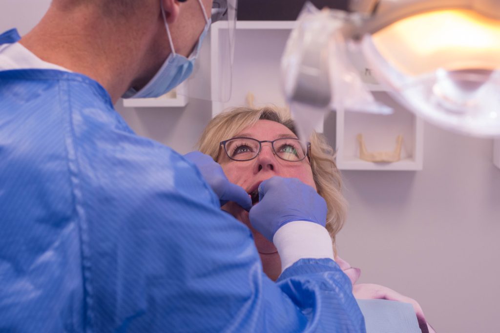 Woman receiving dental cleaning